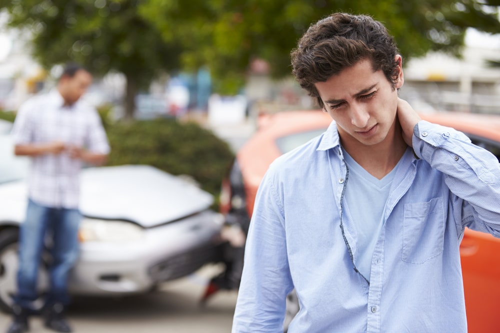 Lawyer reviewing documents with car accident victim